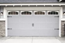 White garage doors with decorative hardware