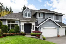 A blue house with a white garage door