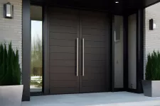 Contemporary-style double entrance door with white vases on either side, filled with greenery
