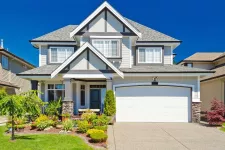 A beautiful home with a well-maintained driveway and a spacious garage