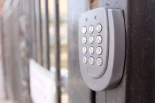 A close-up of a metal door keypad