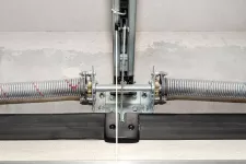 A close-up of garage door springs