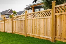 A fence with lattice on the top, providing a decorative and secure boundary