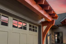 A garage door under a vibrant red sky, creating a captivating contrast of colors