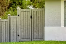 A house with a fence and gate, creating a charming entrance