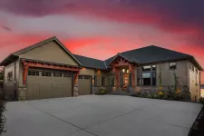 A picturesque home with a stunning sunset as its backdrop