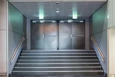 An office building with sleek steel entry doors