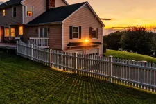 House with a sunset with a beautiful fence
