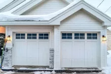 Garage with white garage door in winter