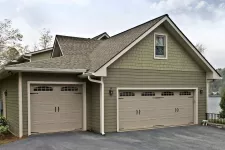 Garage with 2 beige garage doors