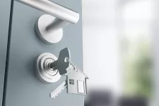 Entrance door with lock, unlocking key and house-shaped key ring