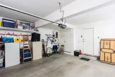 A spacious garage with a sizable storage area and a large storage unit inside.