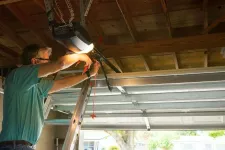 Professional who installs and secures a door opener