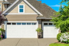 House with 2 white garage doors