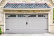 Beige stone house with Sandstone garage door
