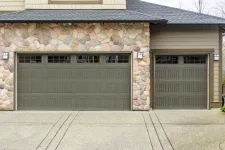 A green garage door on a house