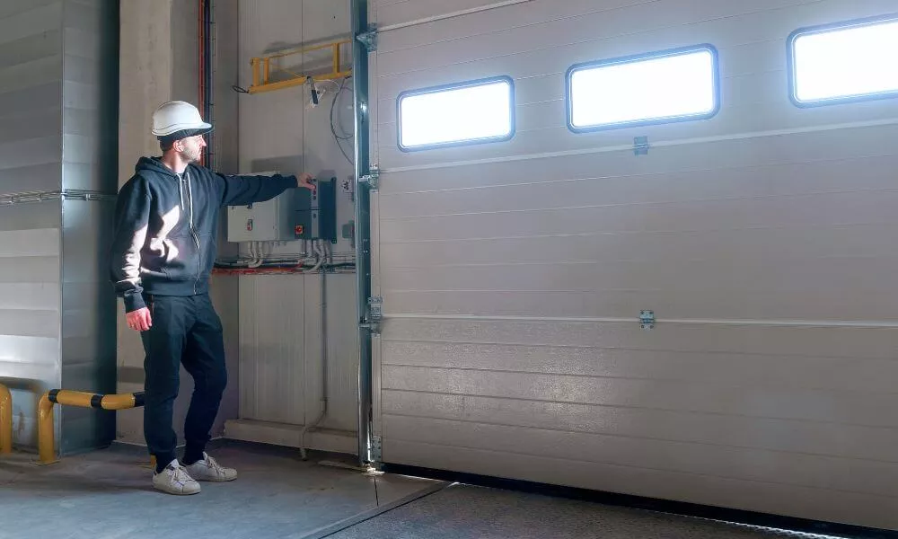 Man tying to open the commercial garage door from the inside