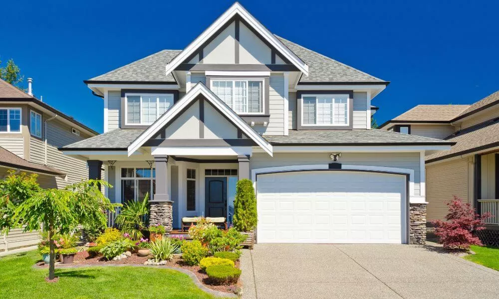 A beautiful home with a well-maintained driveway and a spacious garage