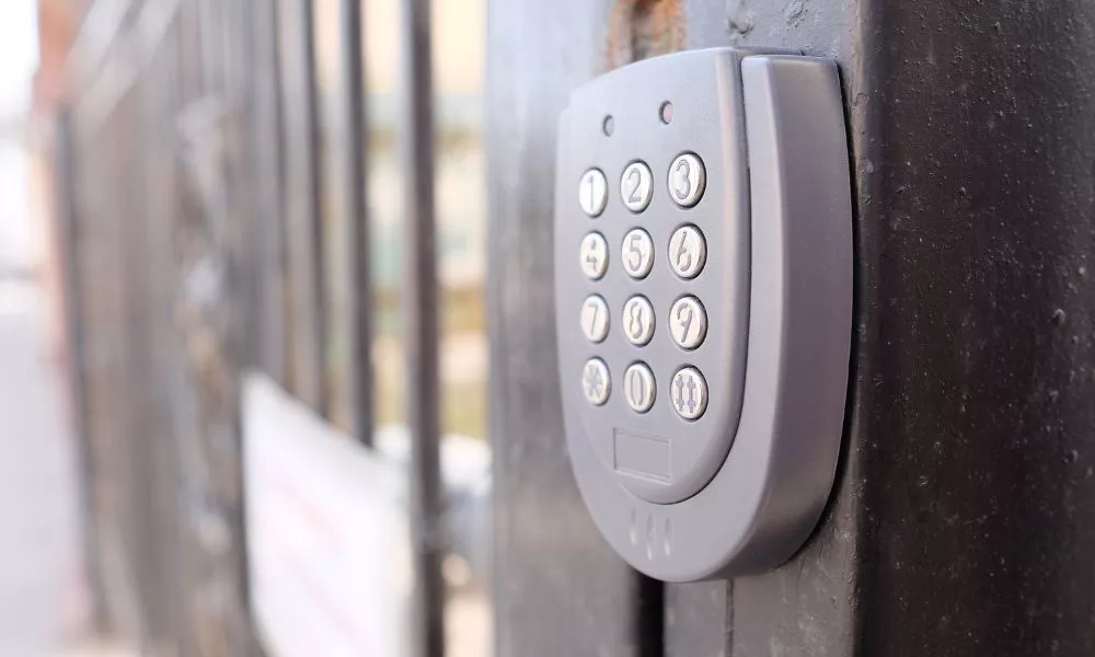 A close-up of a metal door keypad