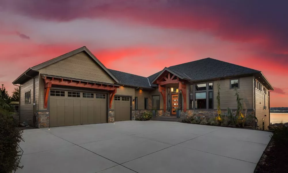 A picturesque home with a stunning sunset as its backdrop