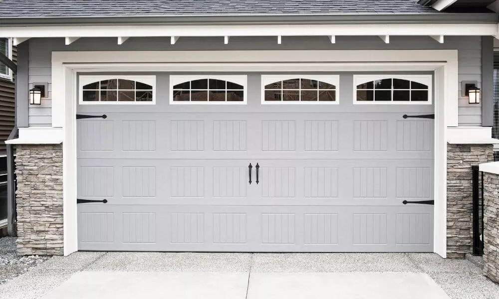 White garage doors with decorative hardware