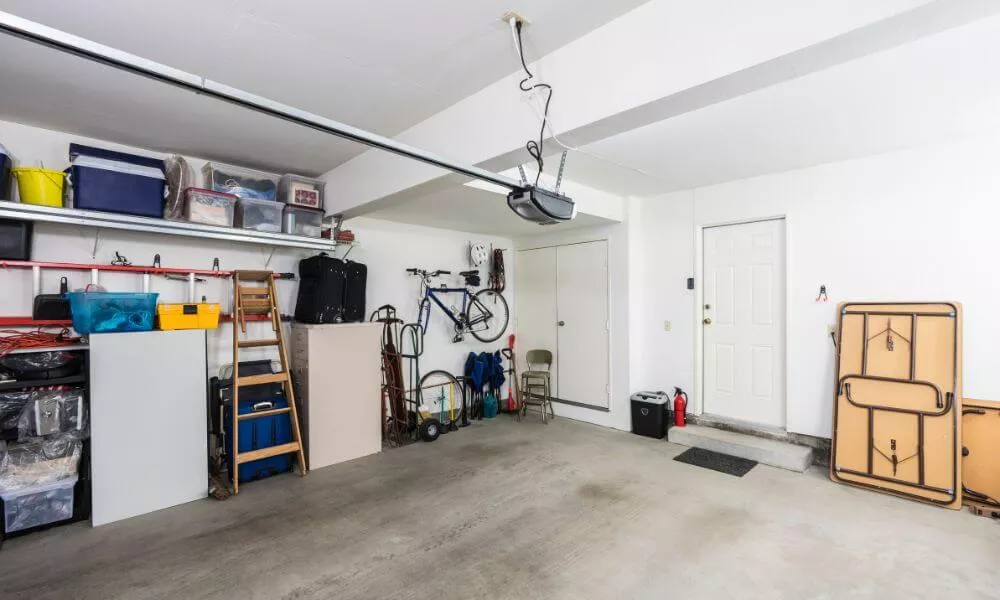 A spacious garage with a sizable storage area and a large storage unit inside.