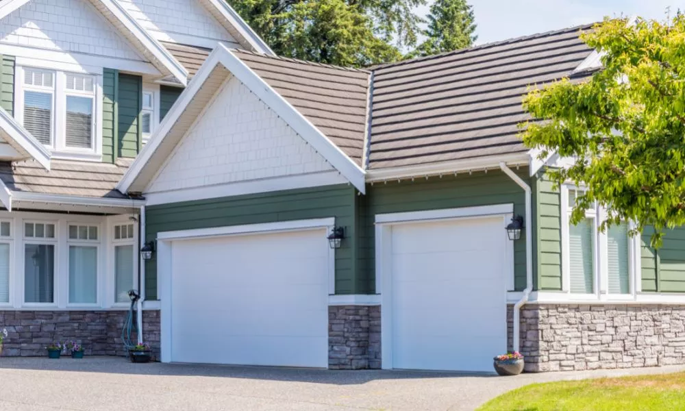 Green house with garage doors