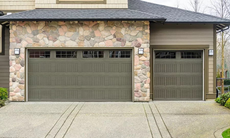 Stone house with two garage doors